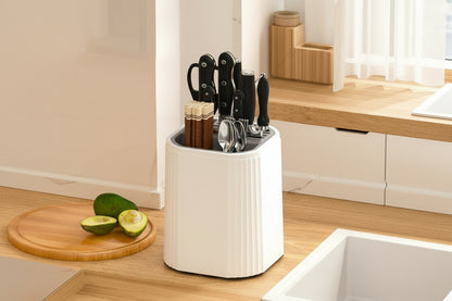 Knife block with 360-degree rotation feature on a kitchen counter.