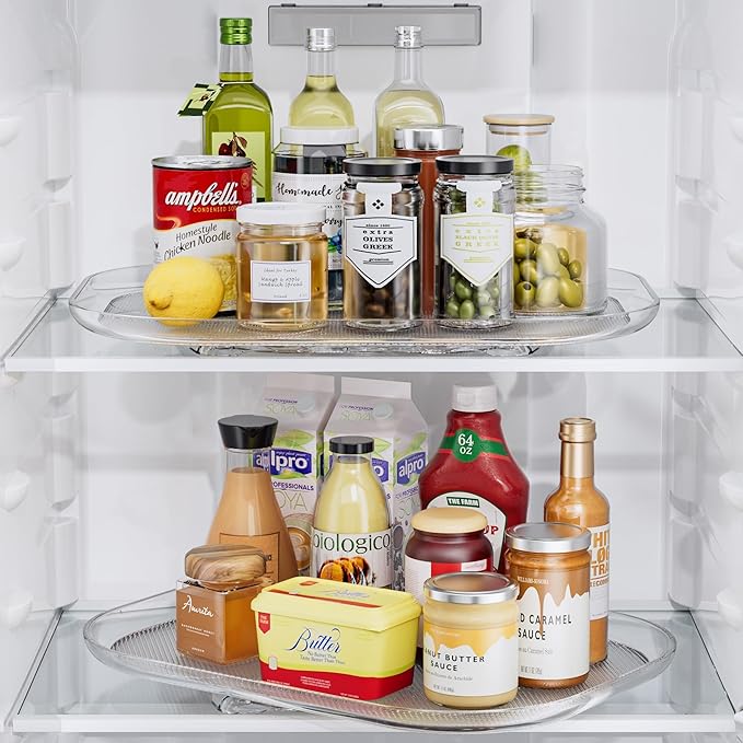 Fridge interior with various food items including bottles, jars, and containers.