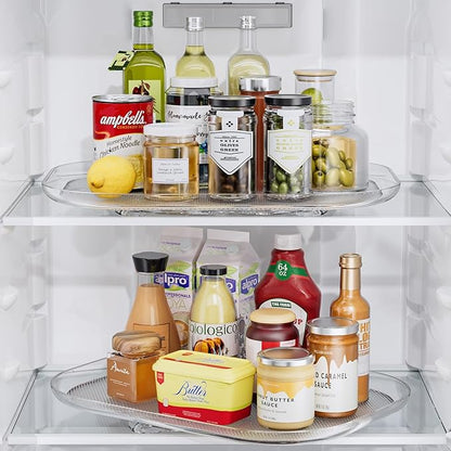 Fridge interior with various food items including bottles, jars, and containers.