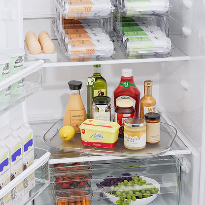 Open refrigerator with various food items and condiments on a shelf.
