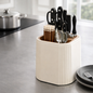 Knife block with cutlery on a kitchen counter